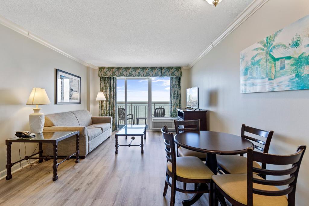 a living room with a couch and a table at Sandy Beach Resort in Myrtle Beach