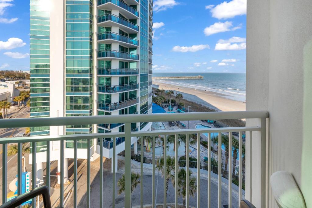a balcony with a view of the beach and ocean at Sandy Beach Resort in Myrtle Beach