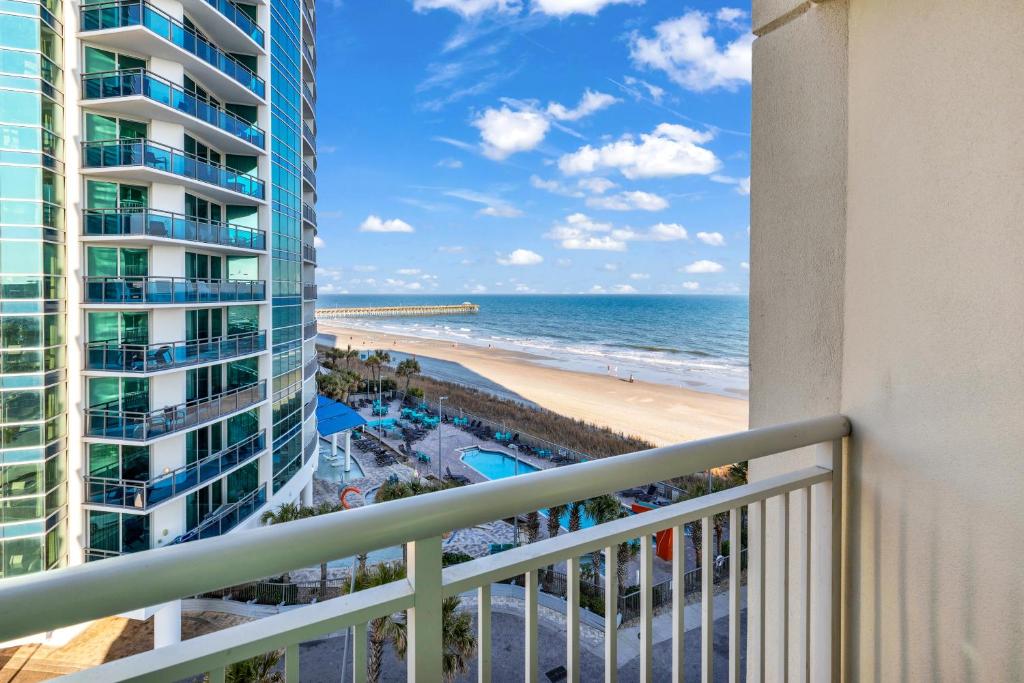 a balcony with a view of the beach and ocean at Sandy Beach Resort in Myrtle Beach