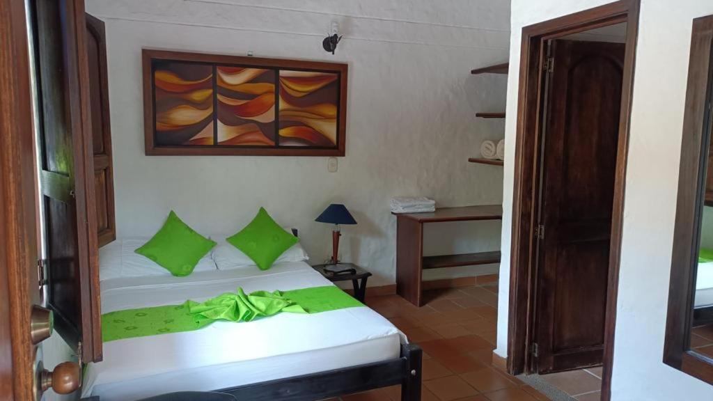 Postel nebo postele na pokoji v ubytování Hotel Verano Resort San Gil