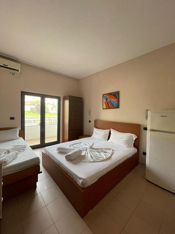 Postel nebo postele na pokoji v ubytování Seashell Beach Rooms