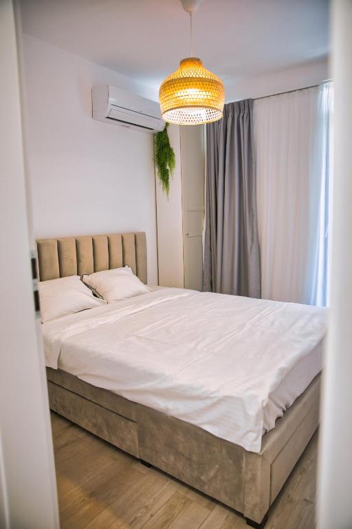 Postel nebo postele na pokoji v ubytování Oxygen Residence Sea View 38