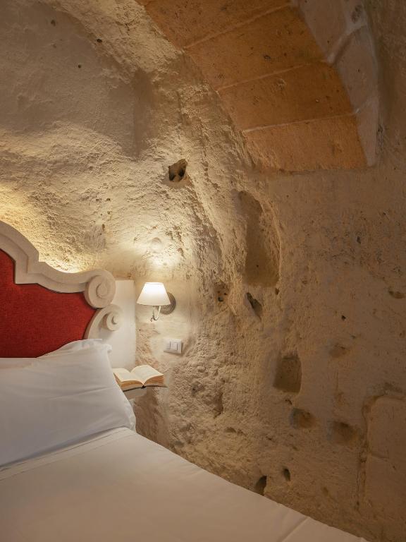 Postel nebo postele na pokoji v ubytování Palazzo Degli Abati