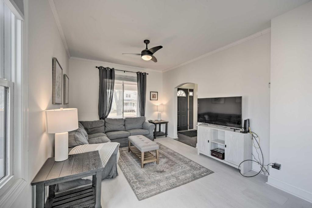 a living room with a couch and a tv at Trendy Superior Home Perfect for Groups! in Superior
