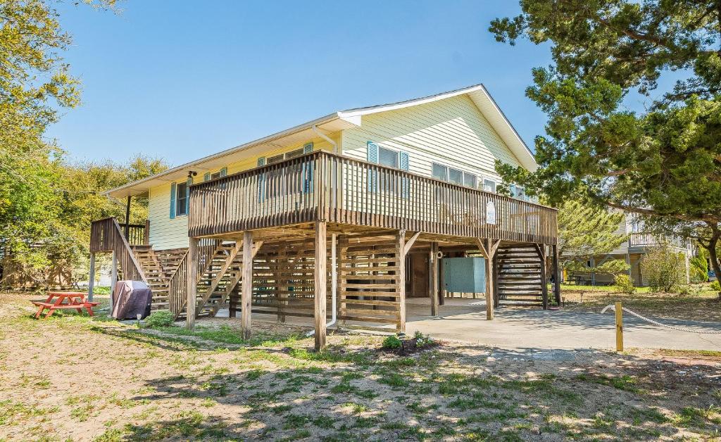 a house constructed out of logs at Landing Pad - Kill Devil Hills, Oceanside, 350 Yards to Beach, Flex Stays, 4 BR in Kill Devil Hills