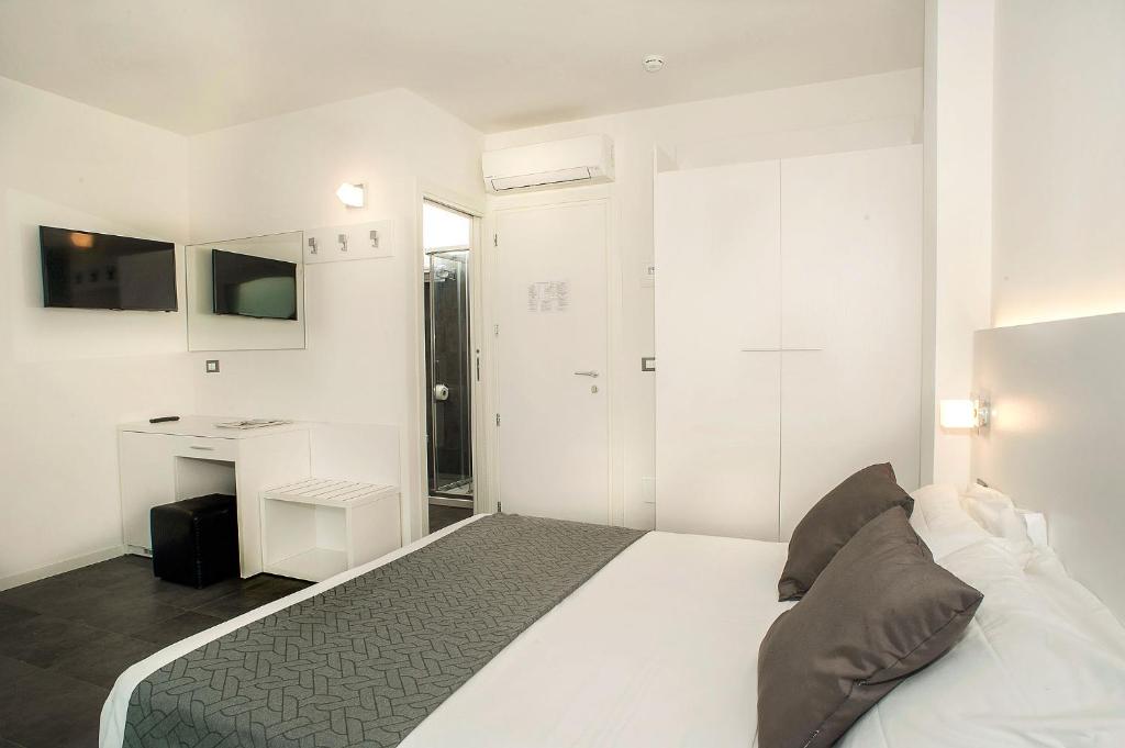 Postel nebo postele na pokoji v ubytování Hotel Niagara