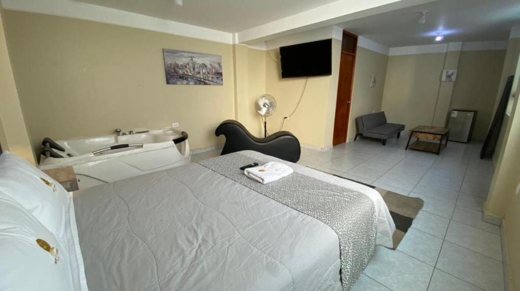 Postel nebo postele na pokoji v ubytování HOTEL MAR Y LAGO