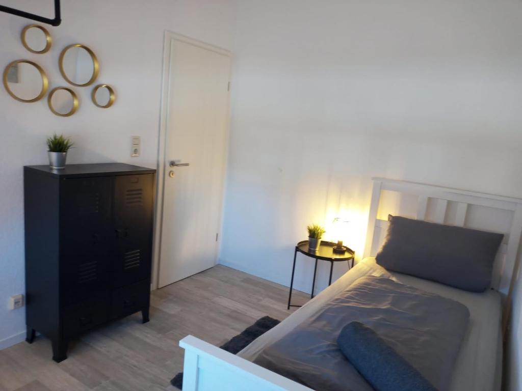 Postel nebo postele na pokoji v ubytování 5 Sterne Ferienwohnung Dünensand