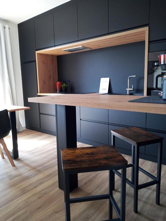 Kuchyň nebo kuchyňský kout v ubytování 5 Sterne Ferienwohnung Dünensand