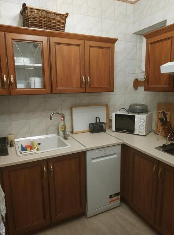 A kitchen or kitchenette at Wagner Apartman Tata