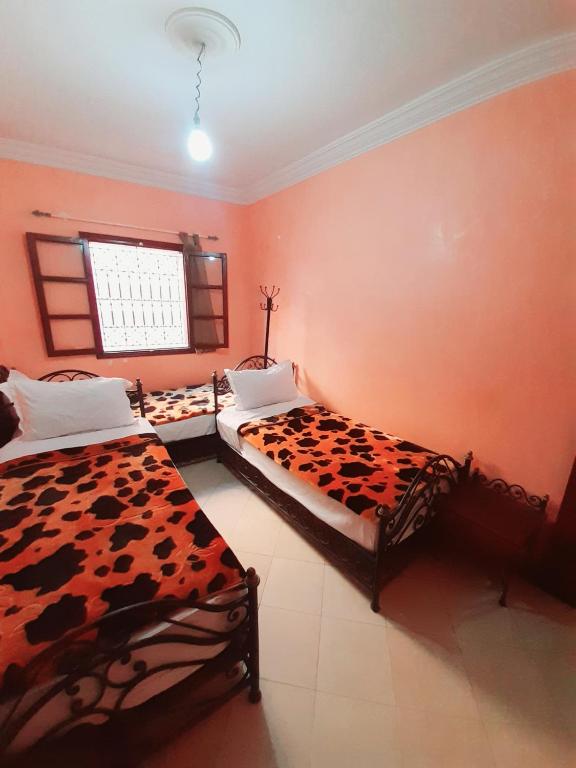 Postel nebo postele na pokoji v ubytování Hotel salem leksor