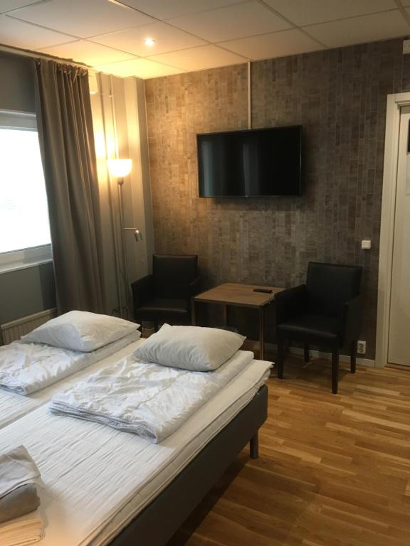 Postel nebo postele na pokoji v ubytování Hostel Snoozemore