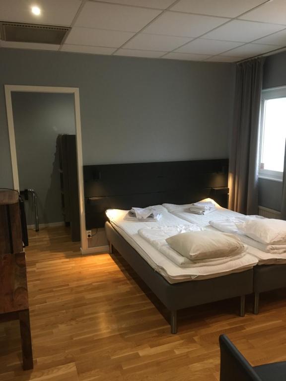 Postel nebo postele na pokoji v ubytování Hostel Snoozemore