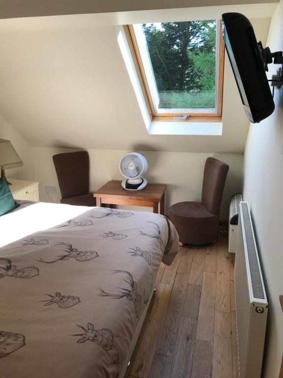 TV a/nebo společenská místnost v ubytování Culag Lochside Self Catering