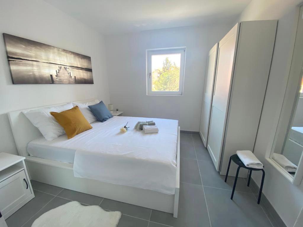 Postel nebo postele na pokoji v ubytování Sara Perfect Stay Novalja