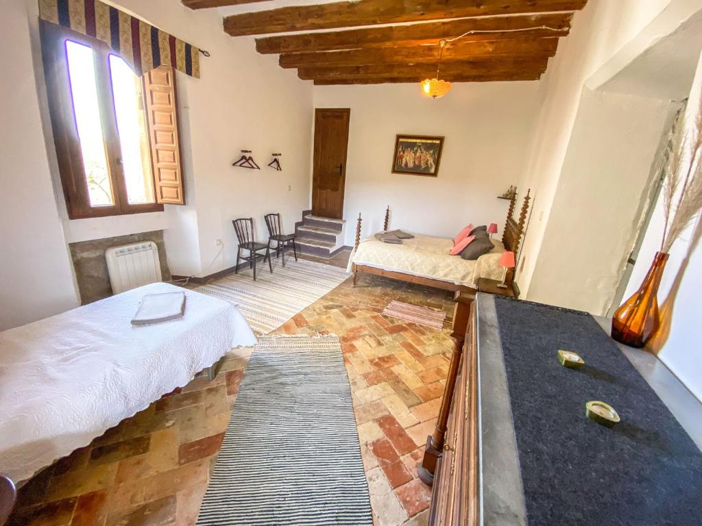 Postel nebo postele na pokoji v ubytování Casa Rural Sant Petrus de Madrona