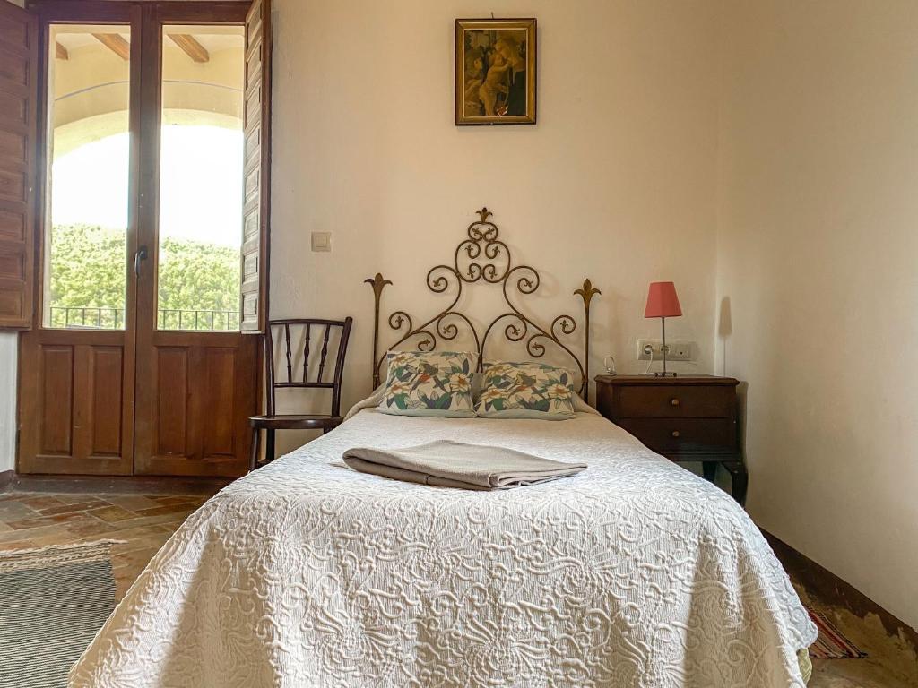 Postel nebo postele na pokoji v ubytování Casa Rural Sant Petrus de Madrona