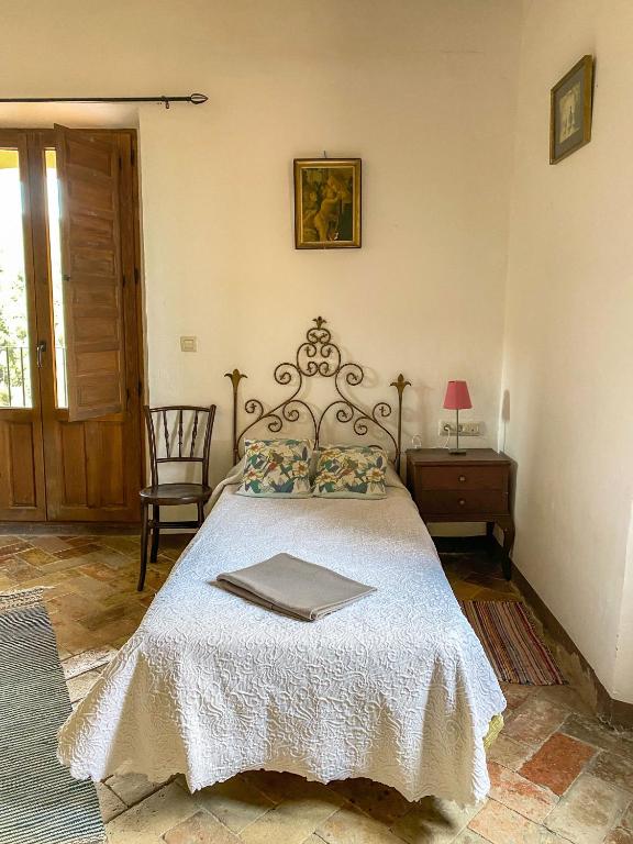 Postel nebo postele na pokoji v ubytování Casa Rural Sant Petrus de Madrona