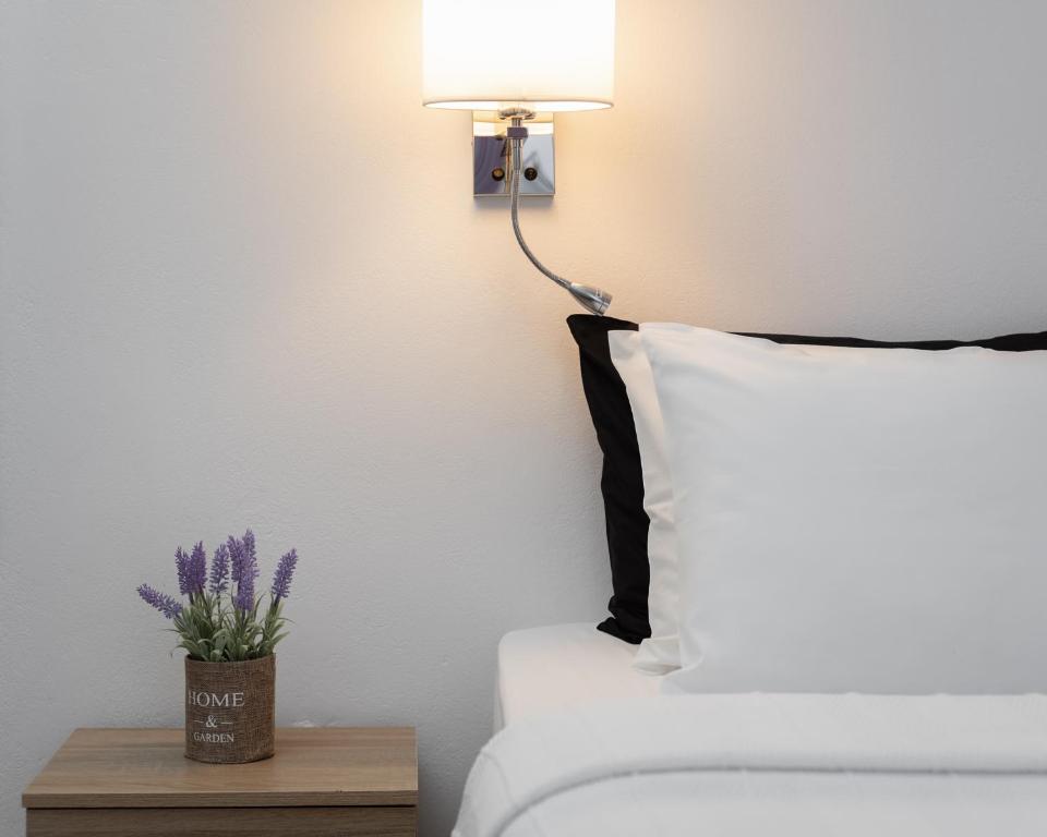 Postel nebo postele na pokoji v ubytování Venus Minimal Hotel