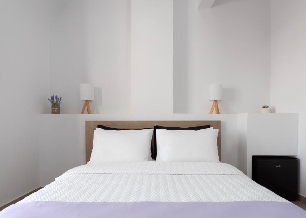 Postel nebo postele na pokoji v ubytování Venus Minimal Hotel