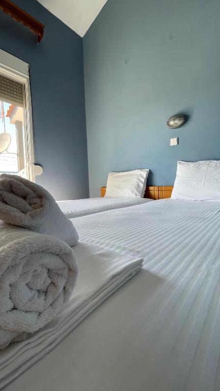 Postel nebo postele na pokoji v ubytování Artemis Hotel Apartments