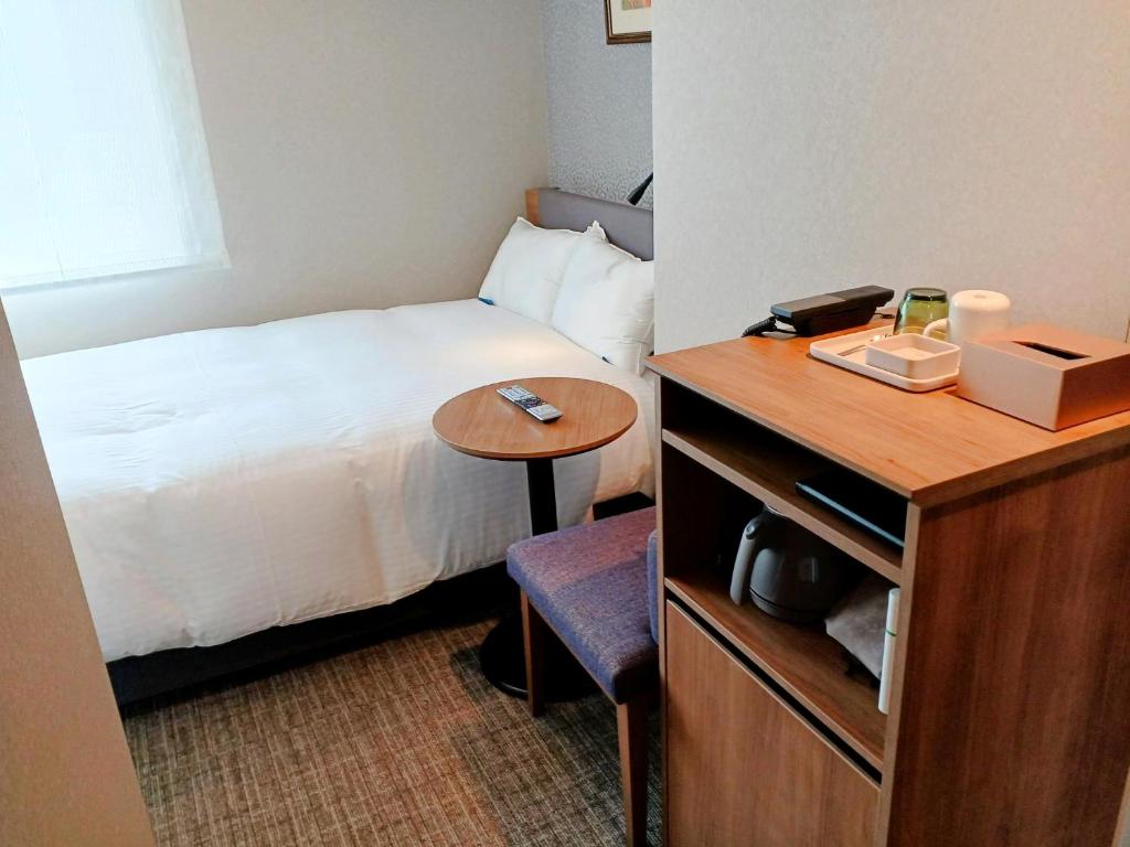 Postel nebo postele na pokoji v ubytování Hotel Rilassare Tokyo