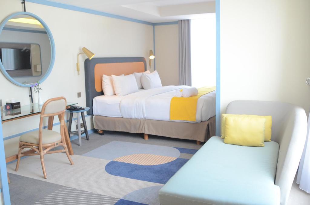 Postel nebo postele na pokoji v ubytování Louis Kienne Hotel Pemuda
