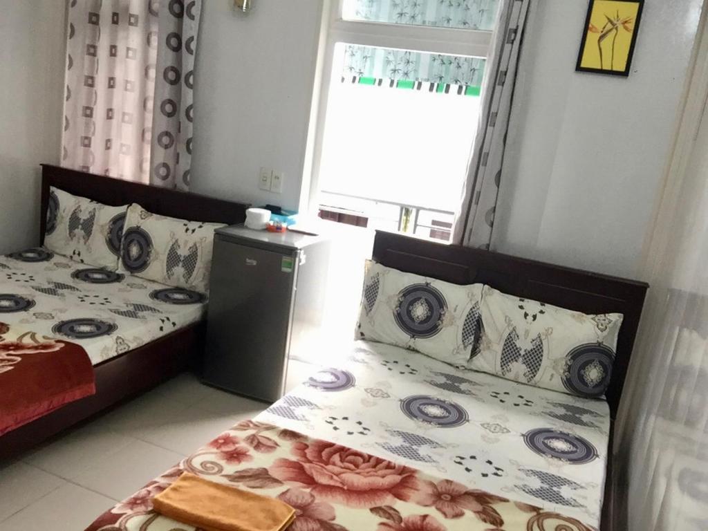 Postel nebo postele na pokoji v ubytování Anh Xuan Guest House