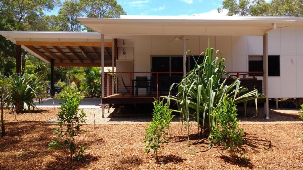 a house with a pavilion in a yard at 15 Esprit Drive Rainbow Shores in Rainbow Beach