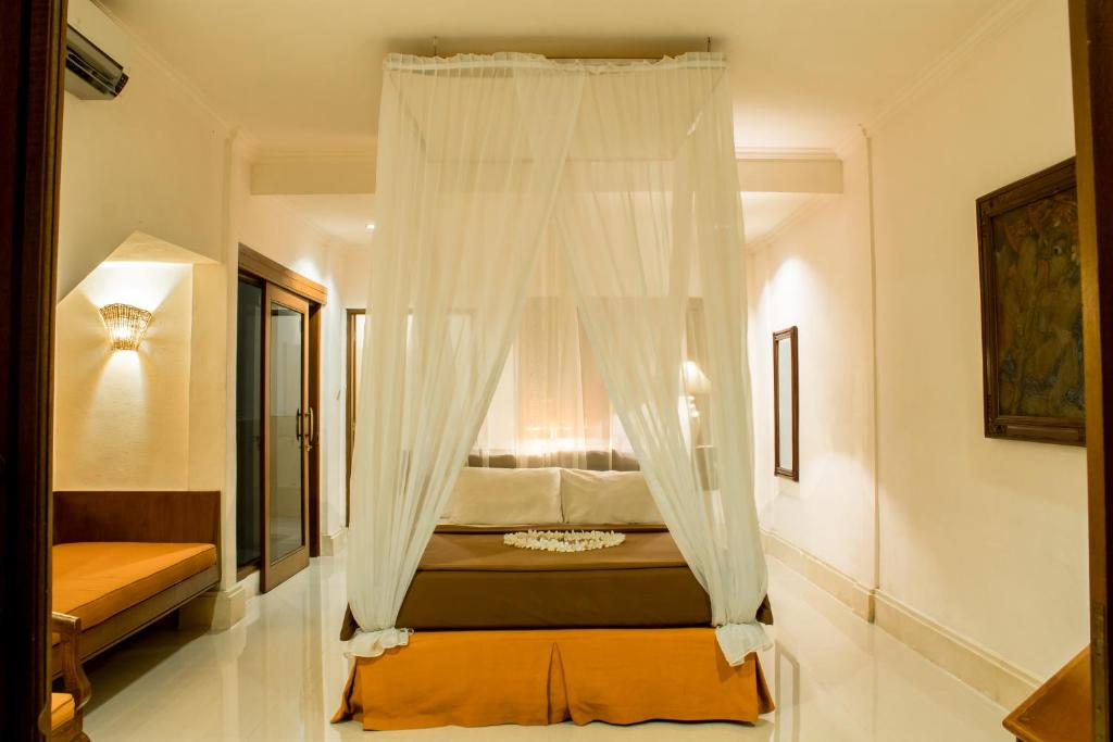 Postel nebo postele na pokoji v ubytování Champlung Sari Hotel and Spa Ubud