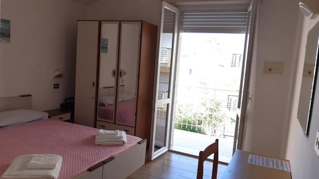 Postel nebo postele na pokoji v ubytování Hotel Elisabetta 2 stelle