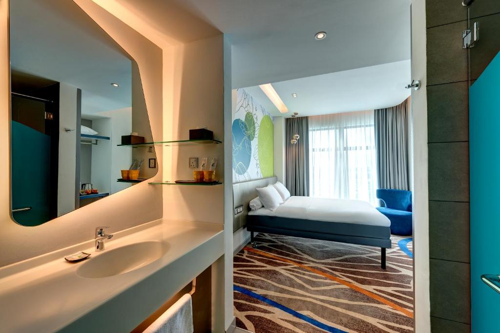 Postel nebo postele na pokoji v ubytování ibis Styles Johor Iskandar Puteri