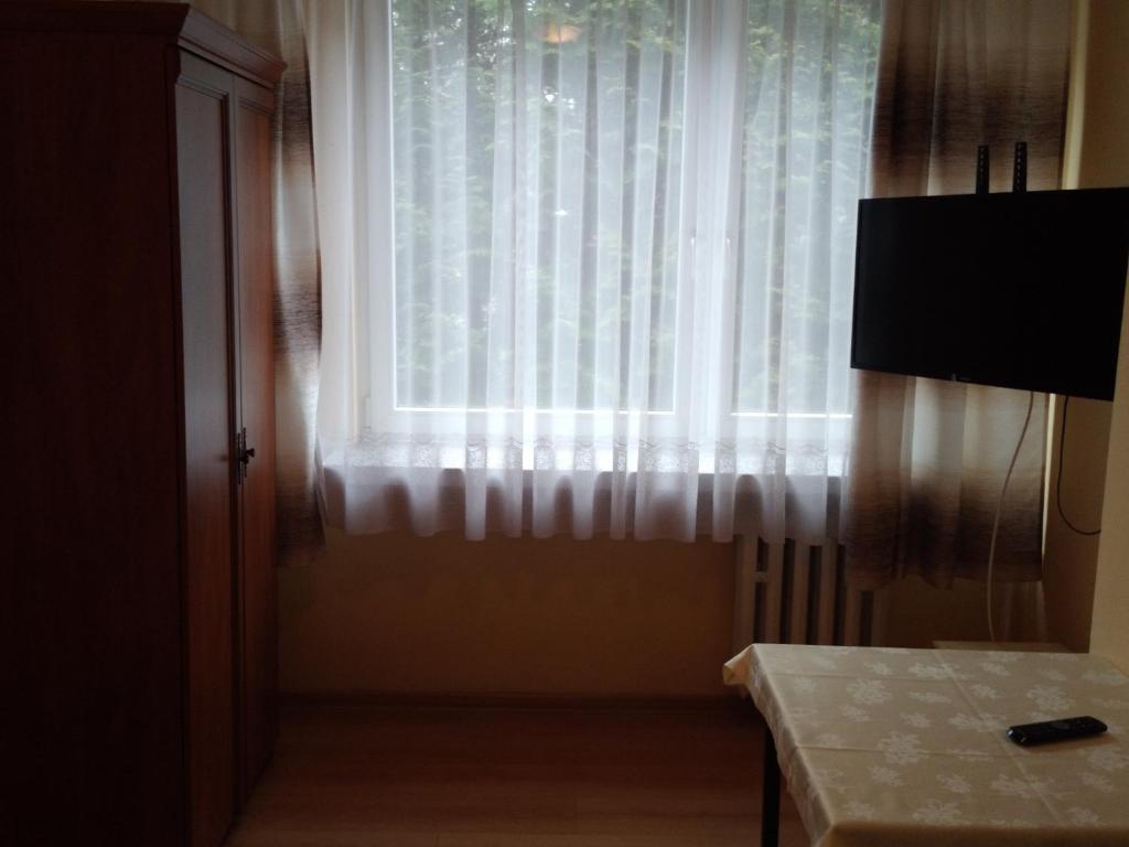 Televízia a/alebo spoločenská miestnosť v ubytovaní CKS Kraków (Centrum Konferencyjno-Szkoleniowe CS Natura Tour)