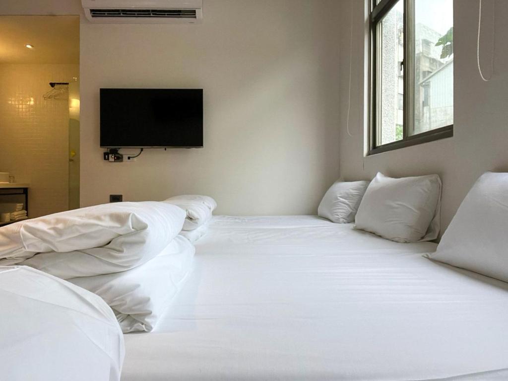 Postel nebo postele na pokoji v ubytování Light Hostel Hualien