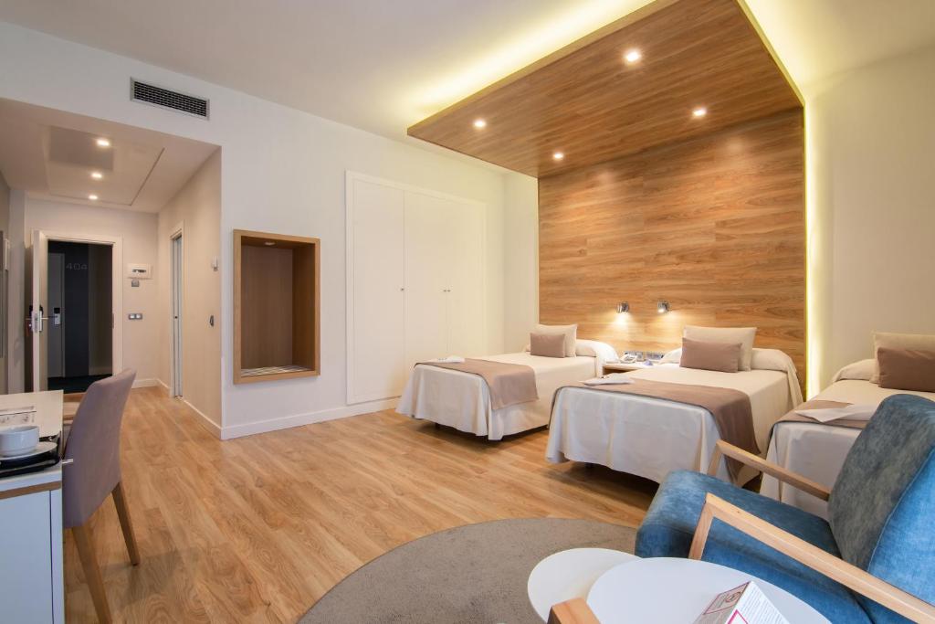 Postel nebo postele na pokoji v ubytování Hotel Monte Puertatierra