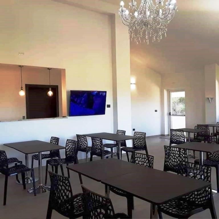 TV a/nebo společenská místnost v ubytování Elios Rooms