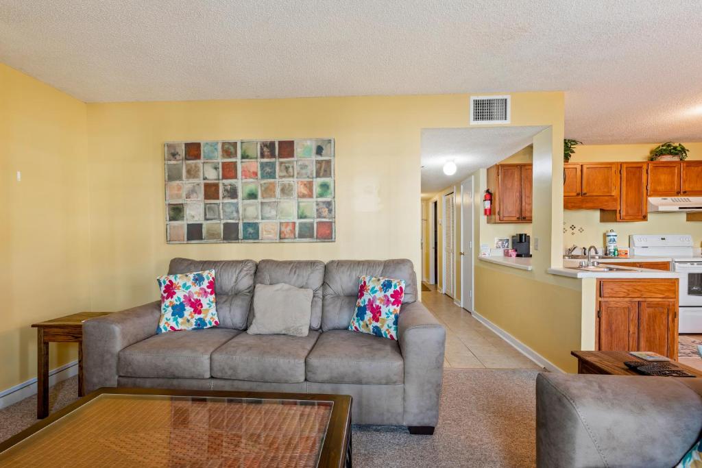 a living room with a couch and a kitchen at Myrtle Beach Resort -B-229 in Myrtle Beach