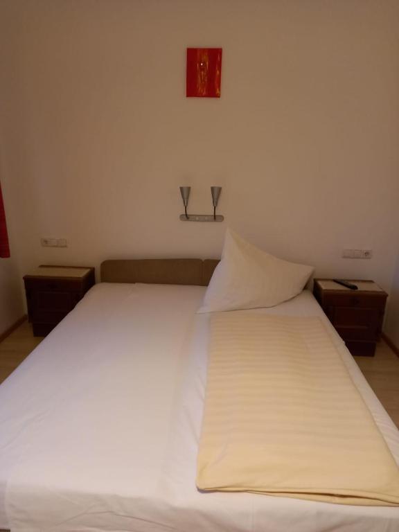 Letto o letti in una camera di Gasthof zum Pfandl