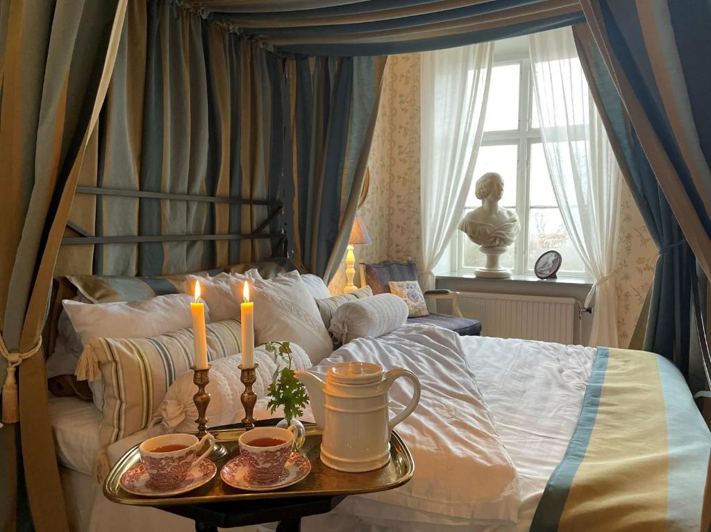 Postel nebo postele na pokoji v ubytování Nääs Slott