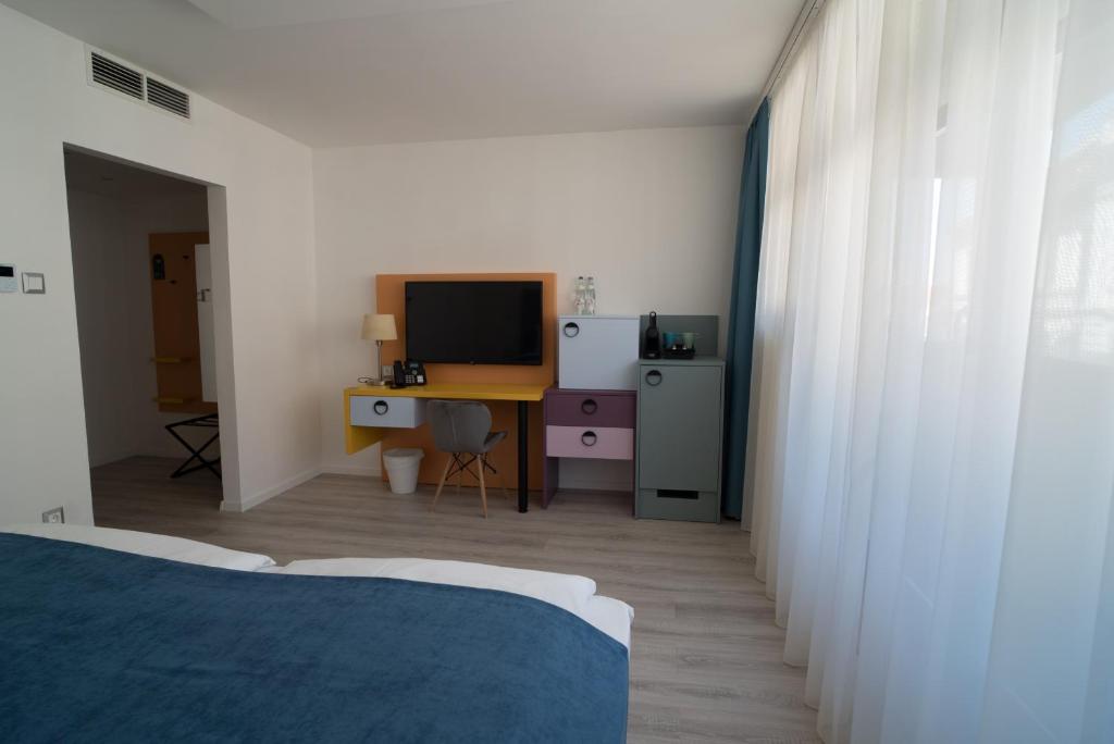 Posteľ alebo postele v izbe v ubytovaní Hotel Civitas