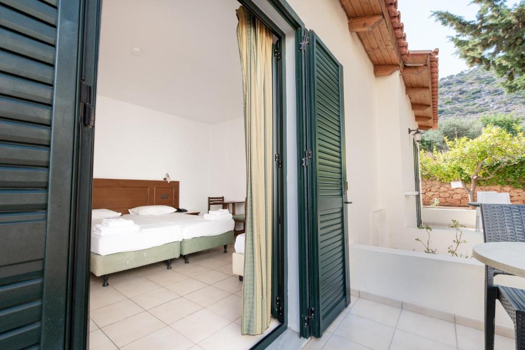 Postel nebo postele na pokoji v ubytování Anastasia Hotel Stalis