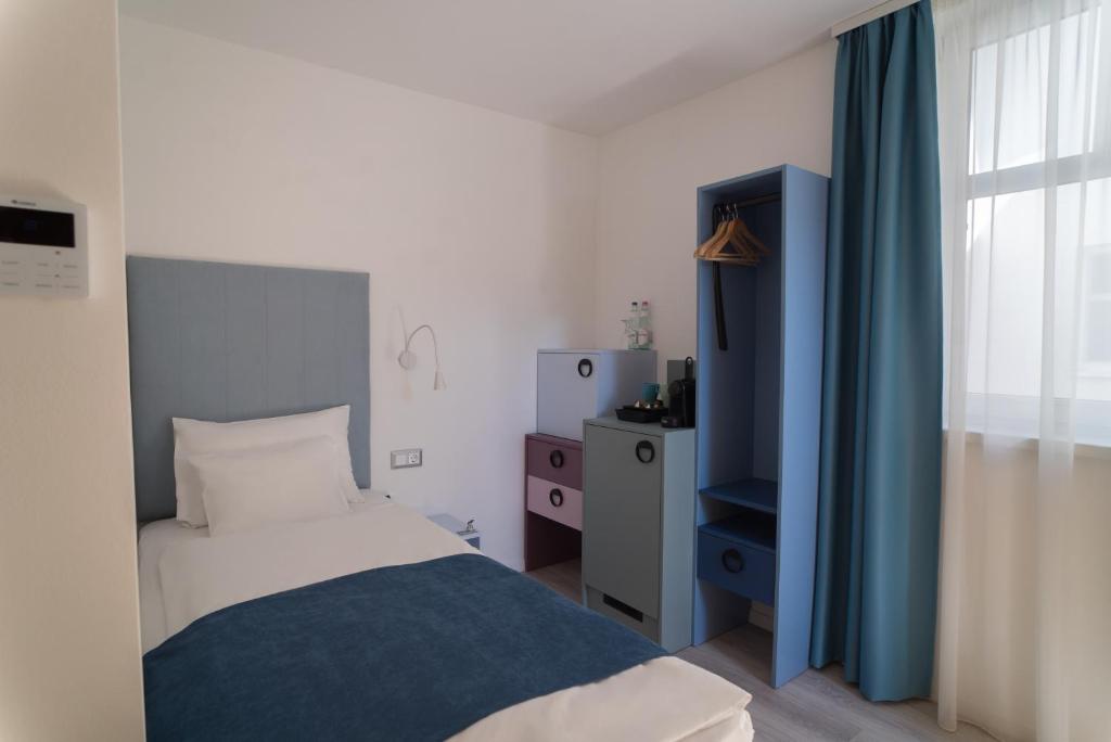 Posteľ alebo postele v izbe v ubytovaní Hotel Civitas