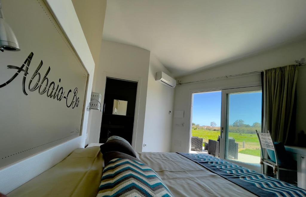 Postel nebo postele na pokoji v ubytování Resort Abbaia Ba