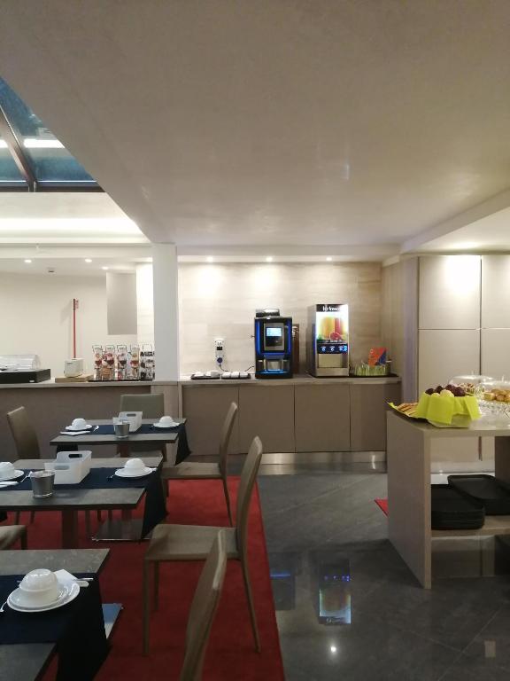 Kuchyň nebo kuchyňský kout v ubytování Gemelli Hotel