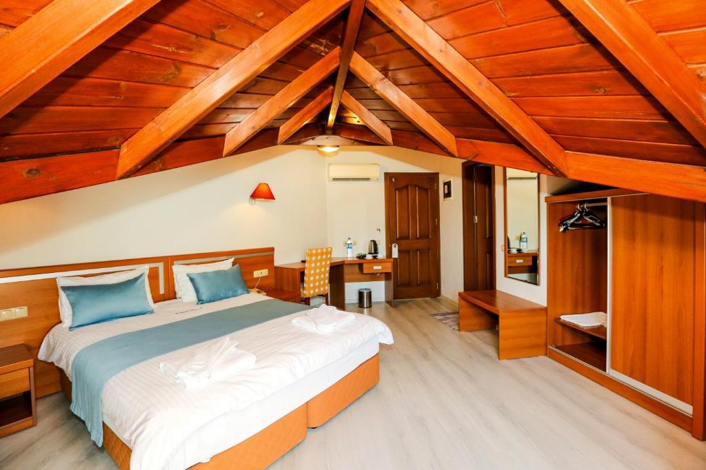 Postel nebo postele na pokoji v ubytování Gocek Unlu Hotel