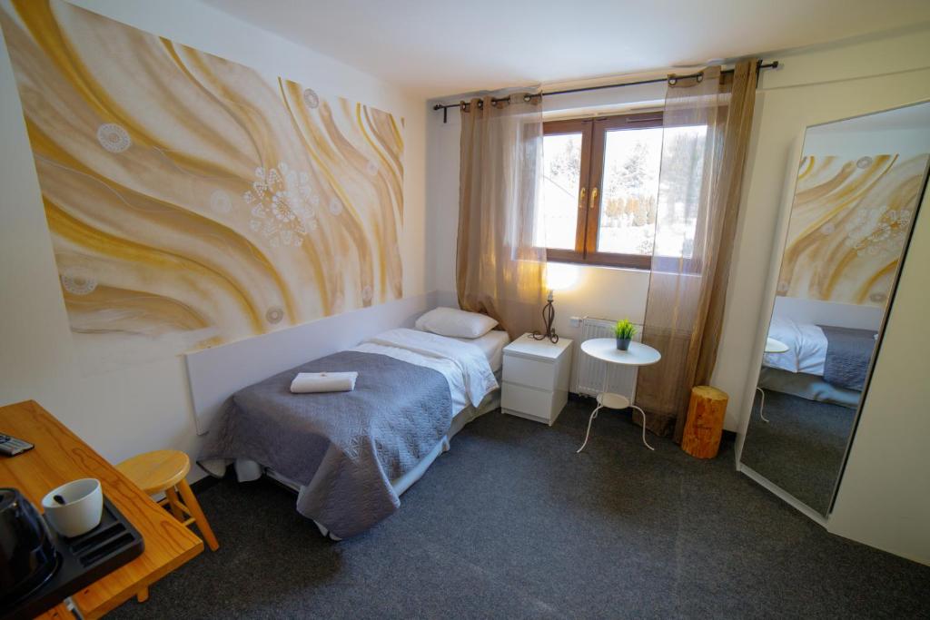 Postel nebo postele na pokoji v ubytování Krokus