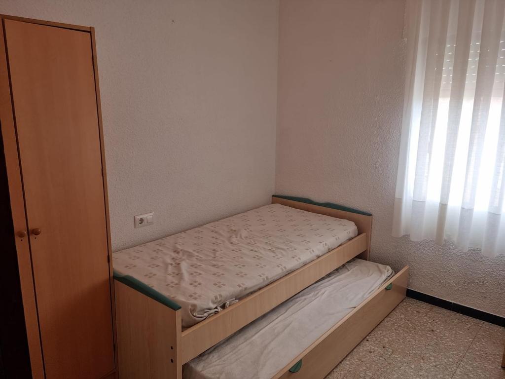 Posteľ alebo postele v izbe v ubytovaní APARTAMENTO LEO