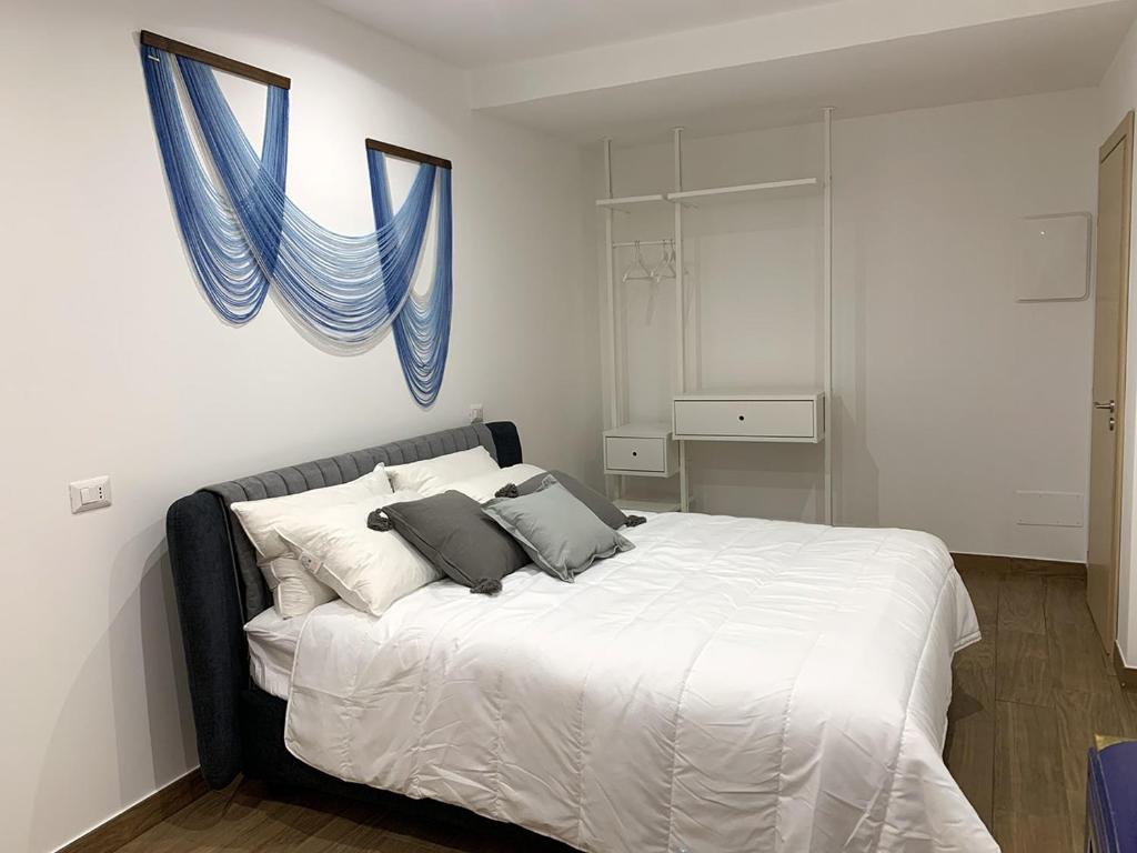 Posteľ alebo postele v izbe v ubytovaní ComfortHouse Ladispoli
