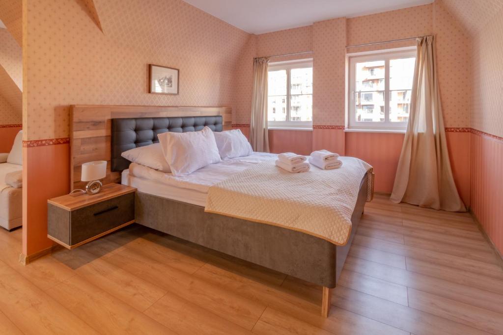 Postel nebo postele na pokoji v ubytování Apartamenty nad Motławą I
