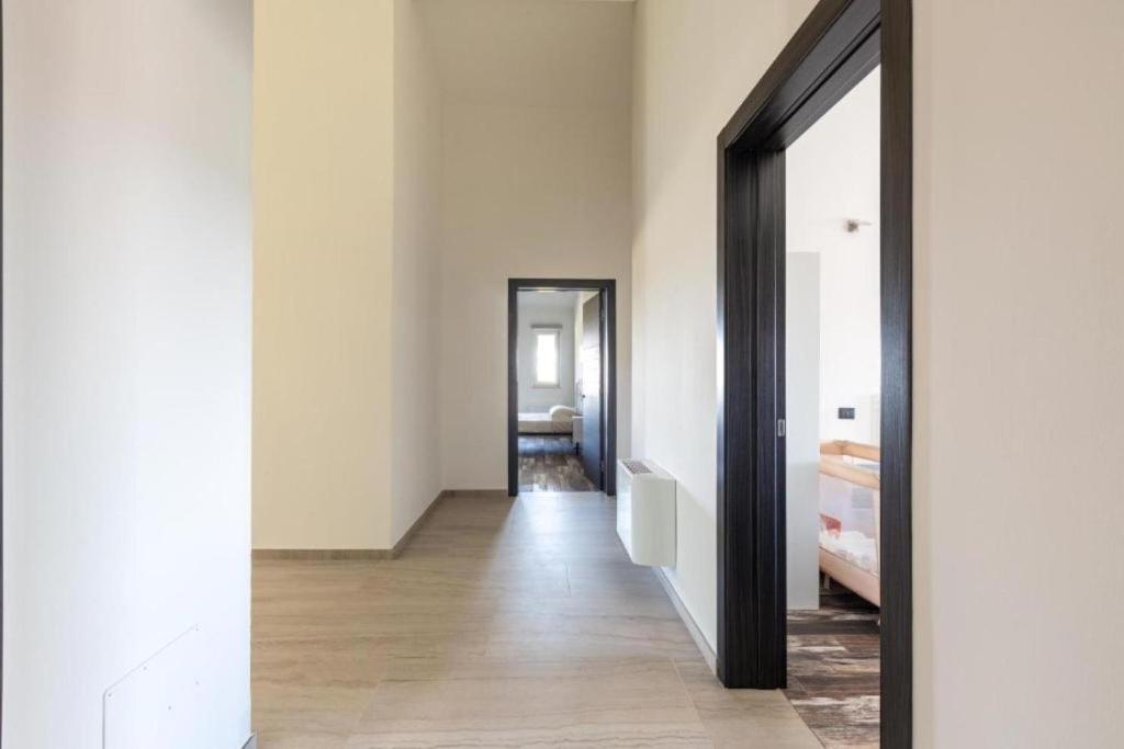 Postel nebo postele na pokoji v ubytování Elios Rooms